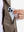 Close-up view of gray brown classic micro suede leather puffer vest inner pocket detail