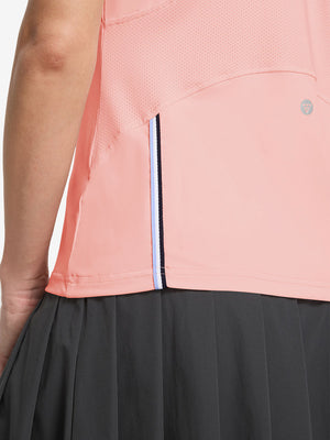 Detail view of hem design on coral powder women's breathable 1/4 zip pullover golf shirts