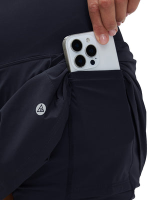 Detail view of inner pocket on navy blue women's stretch a-line golf skort with 7 pockets