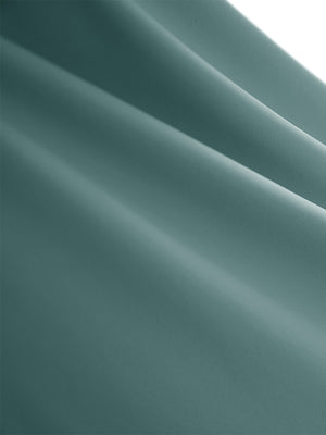 Close-up texture of dusty blue women's high waisted golf skirts with 4 inner pockets fabric showing detailed material and weave.