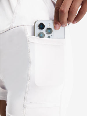 Detail view of inner pocket on white women's stretch a-line golf skort with 7 pockets