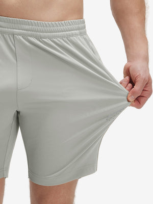 View showing loose fit of silver gray 4 way stretch breathable workout athletic shorts