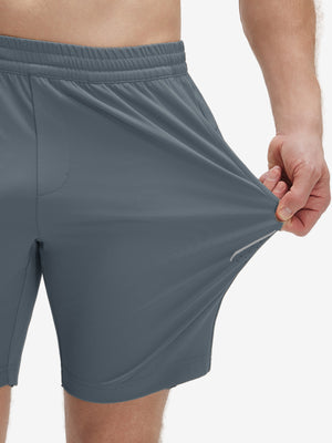 View showing loose fit of grey blue 4 way stretch breathable workout athletic shorts