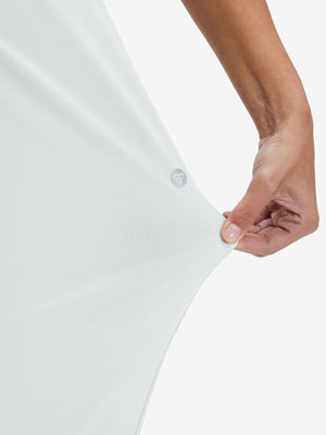 View showing loose fit of white women's lightweight athletic sweatpants