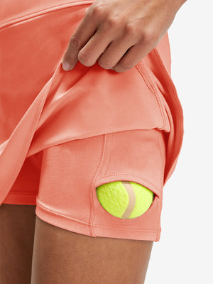 Detail view of inner pocket on peach pink women's stretch a-line golf skort with 7 pockets