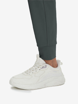Detail view of hem on dark grey women's lightweight athletic sweatpants