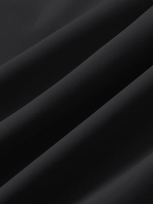 Close-up texture of black 4 way stretch breathable workout athletic shorts fabric showing weave detail.