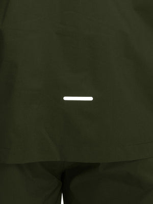 Back hem reflective detail of army green waterproof lightweight rain jacket with hood