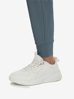 Detail view of hem on grey blue women's lightweight athletic sweatpants