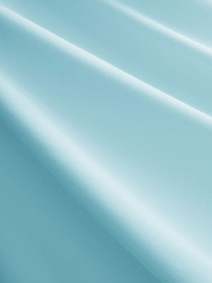 Close-up texture of light blue women's breathable 1/4 zip pullover golf shirts fabric showing breathable weave detail.