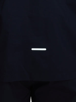 Back hem reflective detail of navy waterproof lightweight rain jacket with hood