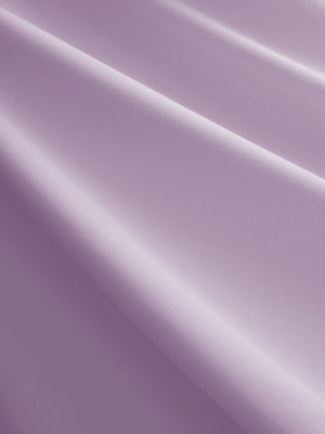 Close-up texture of pinkish purple women's breathable 1/4 zip pullover golf shirts fabric showing breathable weave detail.
