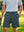 Pantalones cortos elásticos de golf de vestir con frente plano