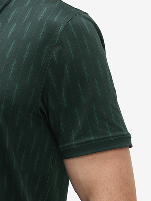 Detail view of cuff on green palm leaves stylish full print contrast collared golf polo shirts
