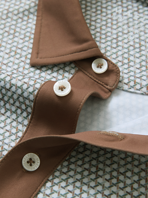 Detail view of collar on hexagon grid stylish full print contrast collared golf polo shirts