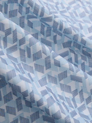 Close-up texture of lines geometric stylish full print contrast collared golf polo shirts fabric showing weave detail.