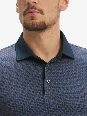 Close-up: nose to chest in dark blue windmill lightweight stretch upgraded print golf polo shirts