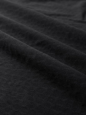 Clear close-up of exquisite jacquard fabric grain and nylon blend texture, nylon blend casual jacquard polo shirts in black